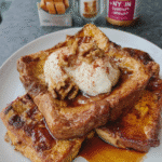 Pumpkin Spice French Toast 7 Indulge in warm, fluffy Pumpkin Spice French Toast! This easy recipe features brioche bread soaked in pumpkin puree and spices, baked to golden perfection, and topped with cheesecake whip and brown butter maple syrup. Perfect for a delicious fall breakfast or brunch!