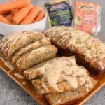 Easy Zucchini Recipes 7 Moist and flavorful Carrot Apple Zucchini Bread recipe! This quick bread is packed with vibrant colors and irresistible flavor. A perfect breakfast, snack, or dessert featuring grated carrots, zucchini, diced apples, and crunchy pecans with a cream cheese glaze.