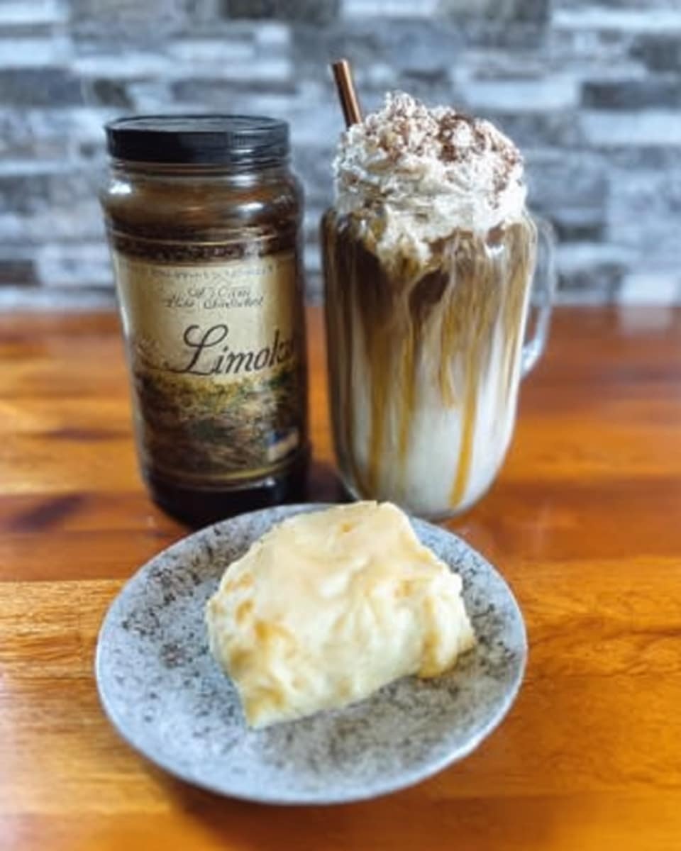 Pumpkin Sweet Cream Cold Foam being poured over cold brew